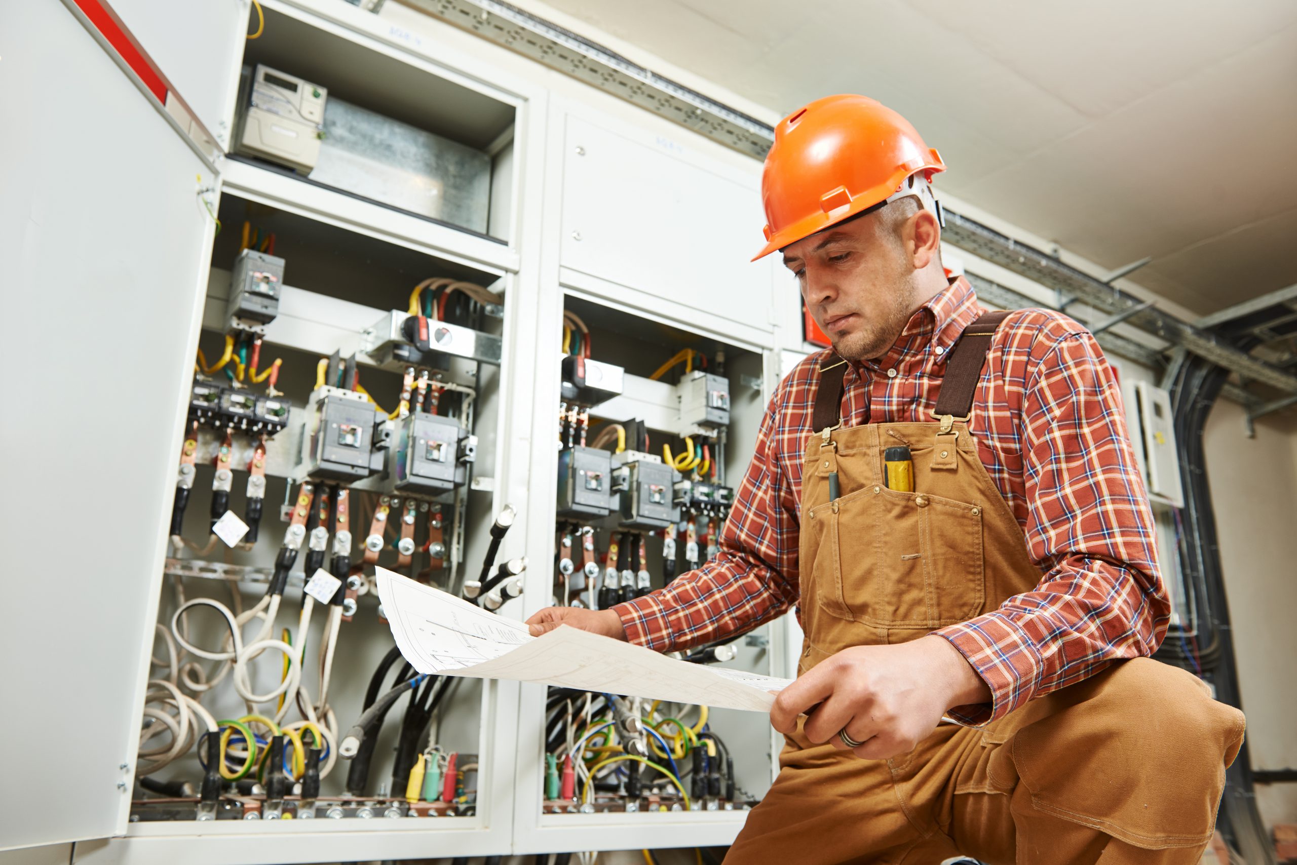 Electrical engineer in circuit room.